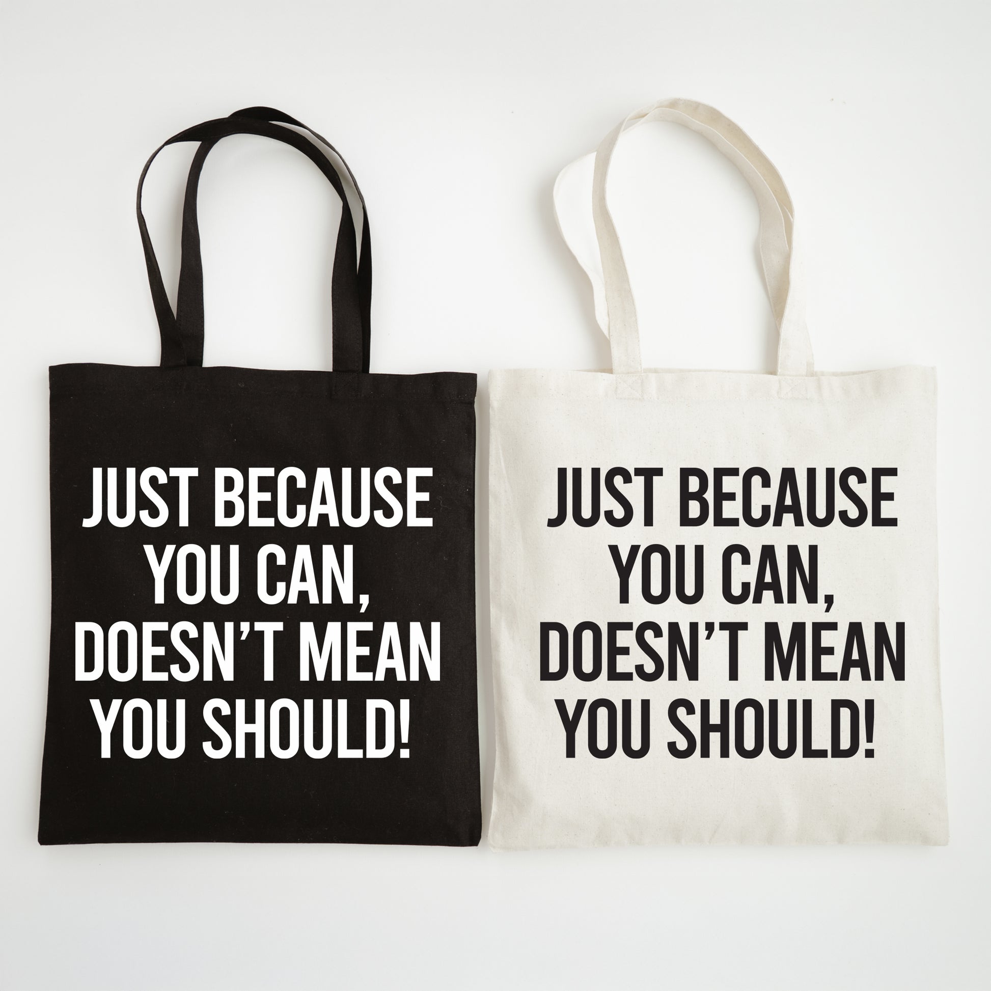 Two tote bags with motivational text on a white background