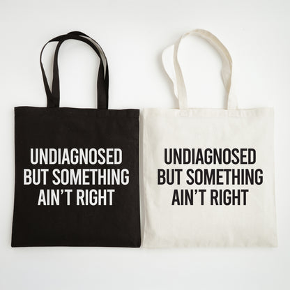 Black and white tote bags with text on a white background