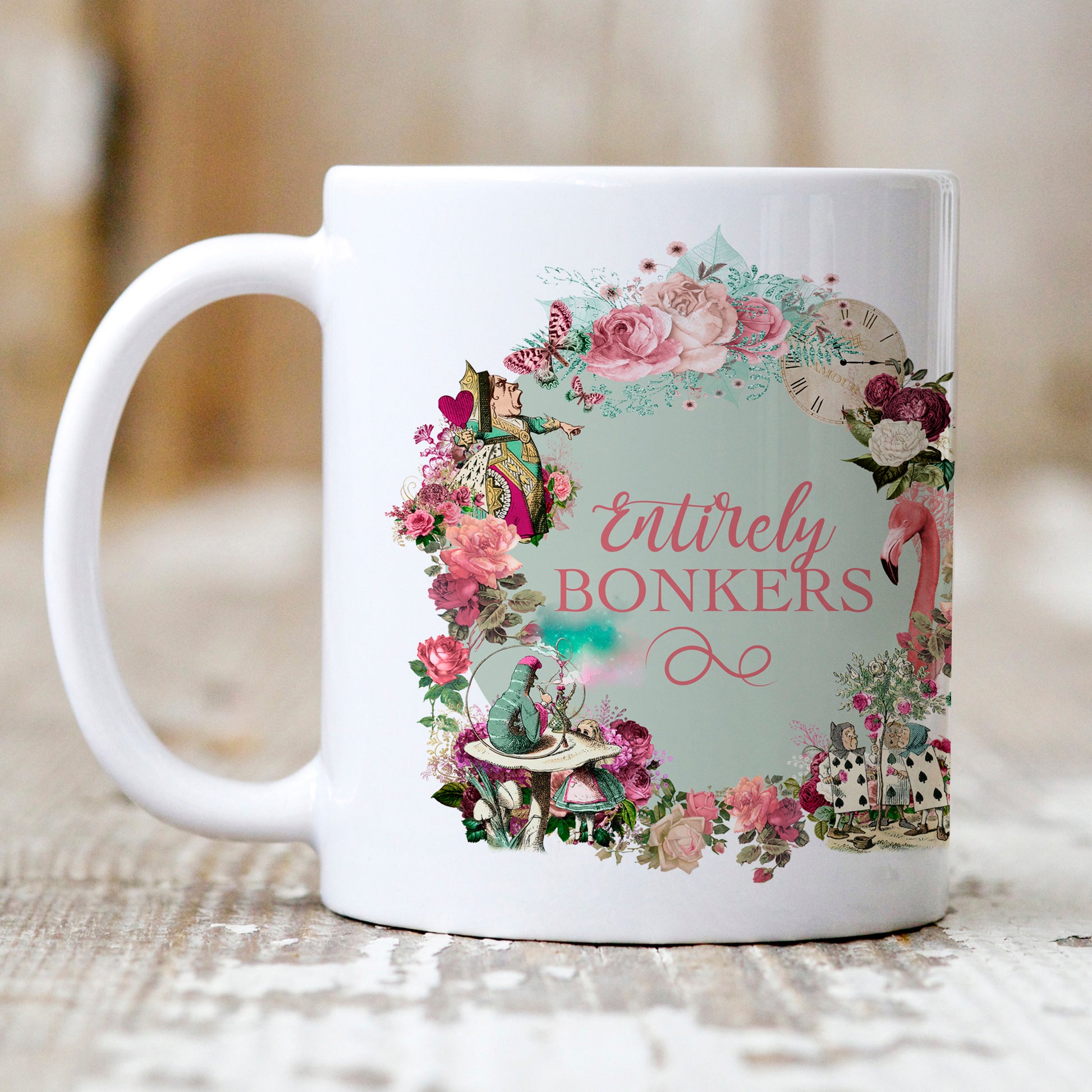 Alice in Wonderland Mug Gift picturing a montage of flowers and wonderland characters including the queen of hearts, Alice and the Caterpillar with the phrase 'Entirely Bonkers'