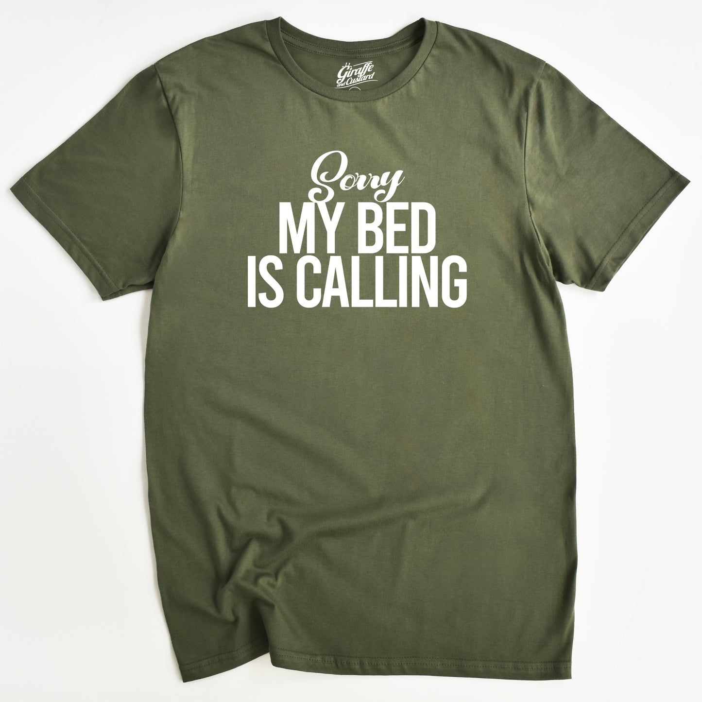 Green t-shirt with 'Sorry My Bed Is Calling' text on a white background