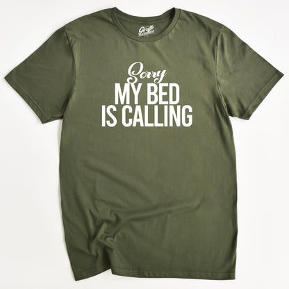 Green t-shirt with 'Sorry My Bed Is Calling' text on a white background