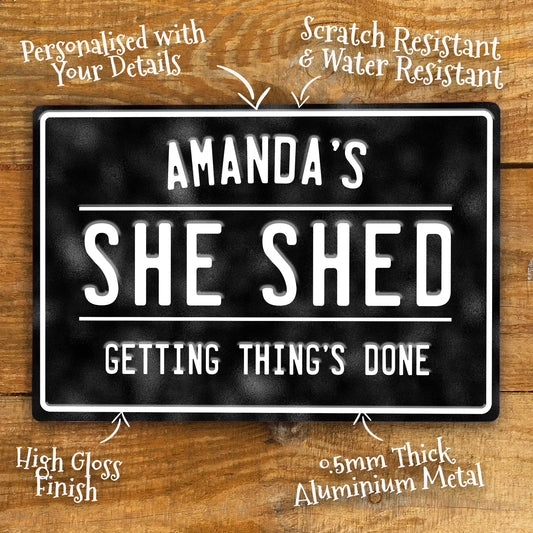 Personalised She Shed Metal Sign in black with white text showing dimensions