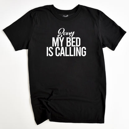 Black t-shirt with white text 'Sorry My Bed Is Calling' on a white background