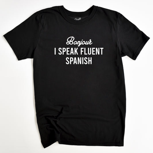 Black T-shirt with the text 'Bonjour I SPEAK FLUENT SPANISH' printed in white.