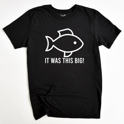 Black t-shirt with a white graphic of a fish and the text 'IT WAS THIS BIG!' on the front.