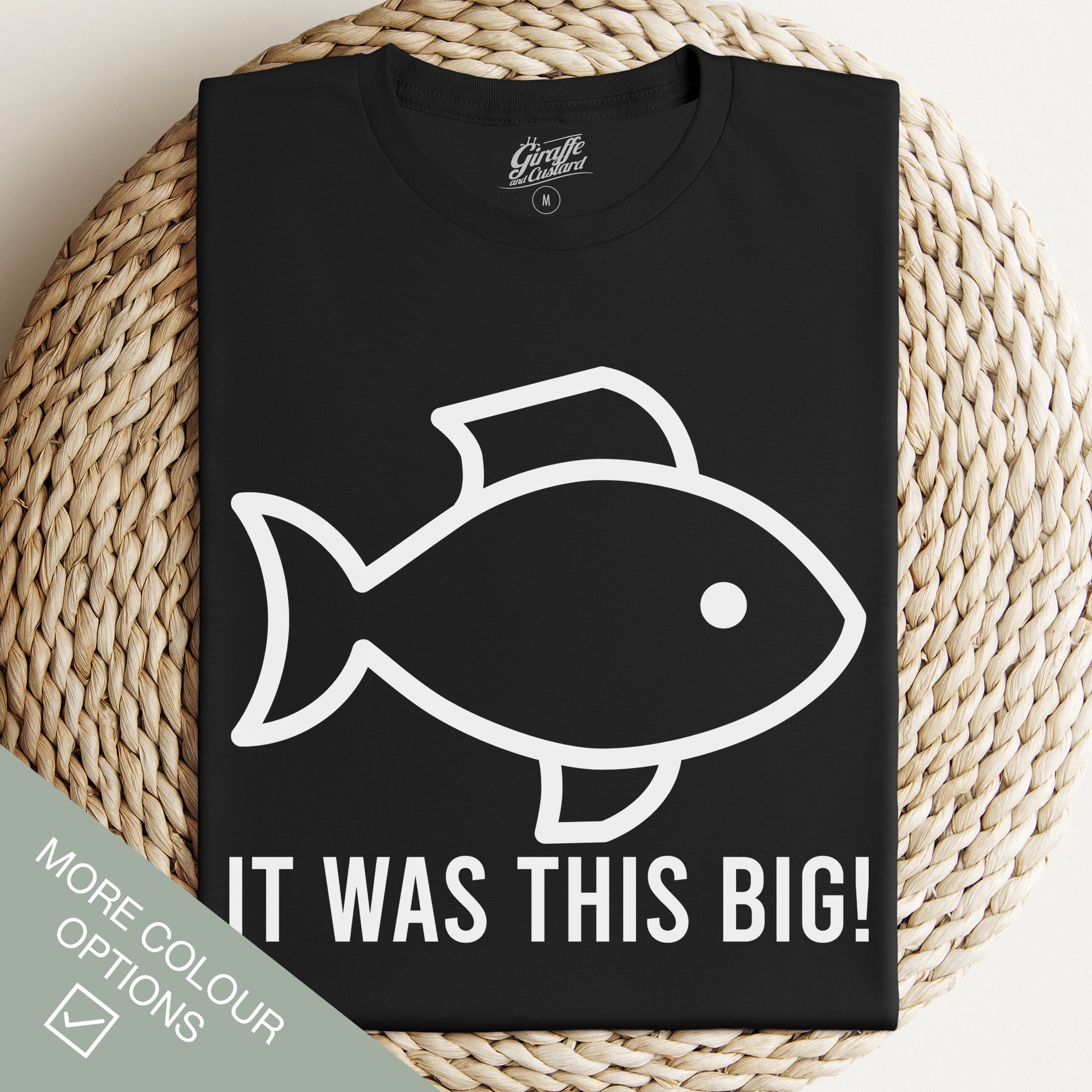 Black t-shirt with a white graphic of a fish and the text 'IT WAS THIS BIG!' on the front.