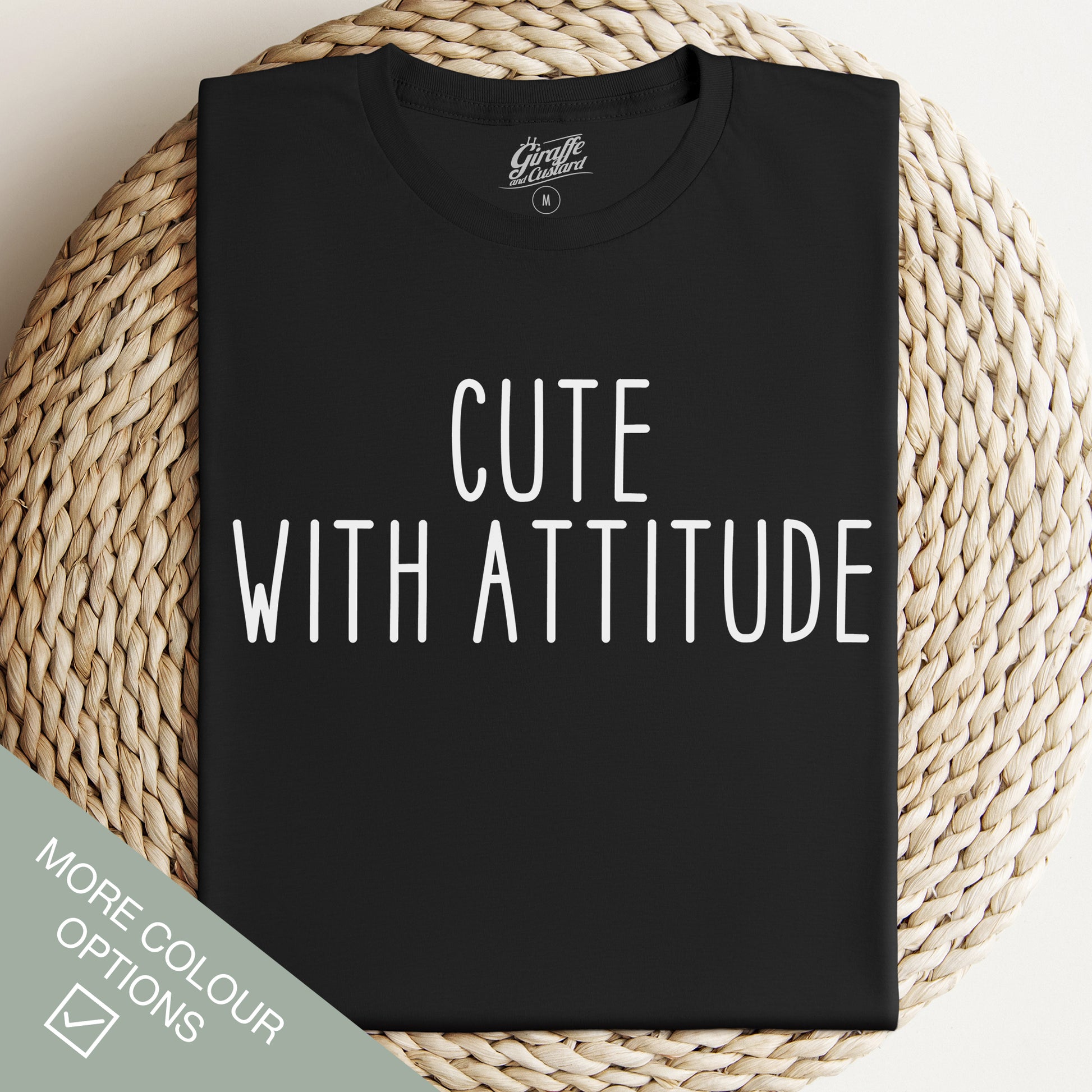 Black T-shirt with the text 'CUTE WITH ATTITUDE' printed in white on the front.