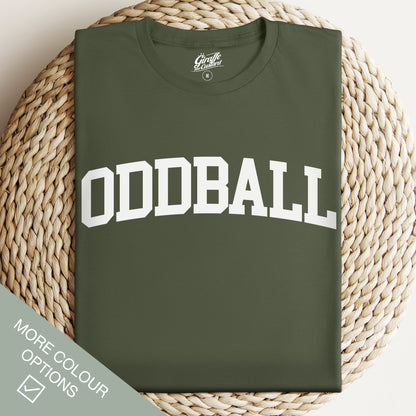 Green t-shirt with 'ODDBALL' text on a woven surface