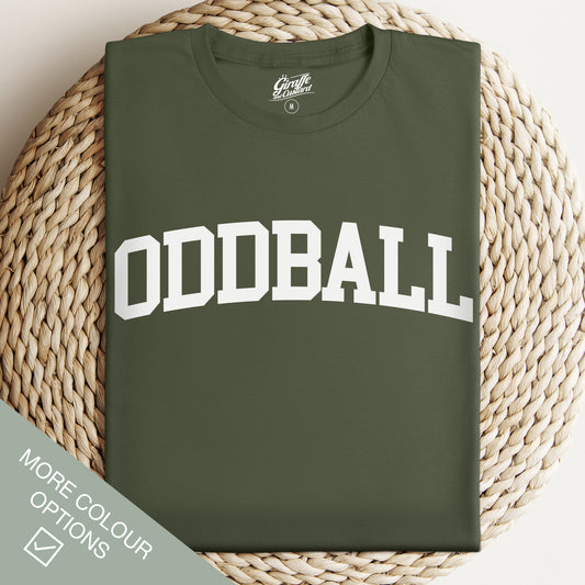 Green t-shirt with 'ODDBALL' text on a woven surface