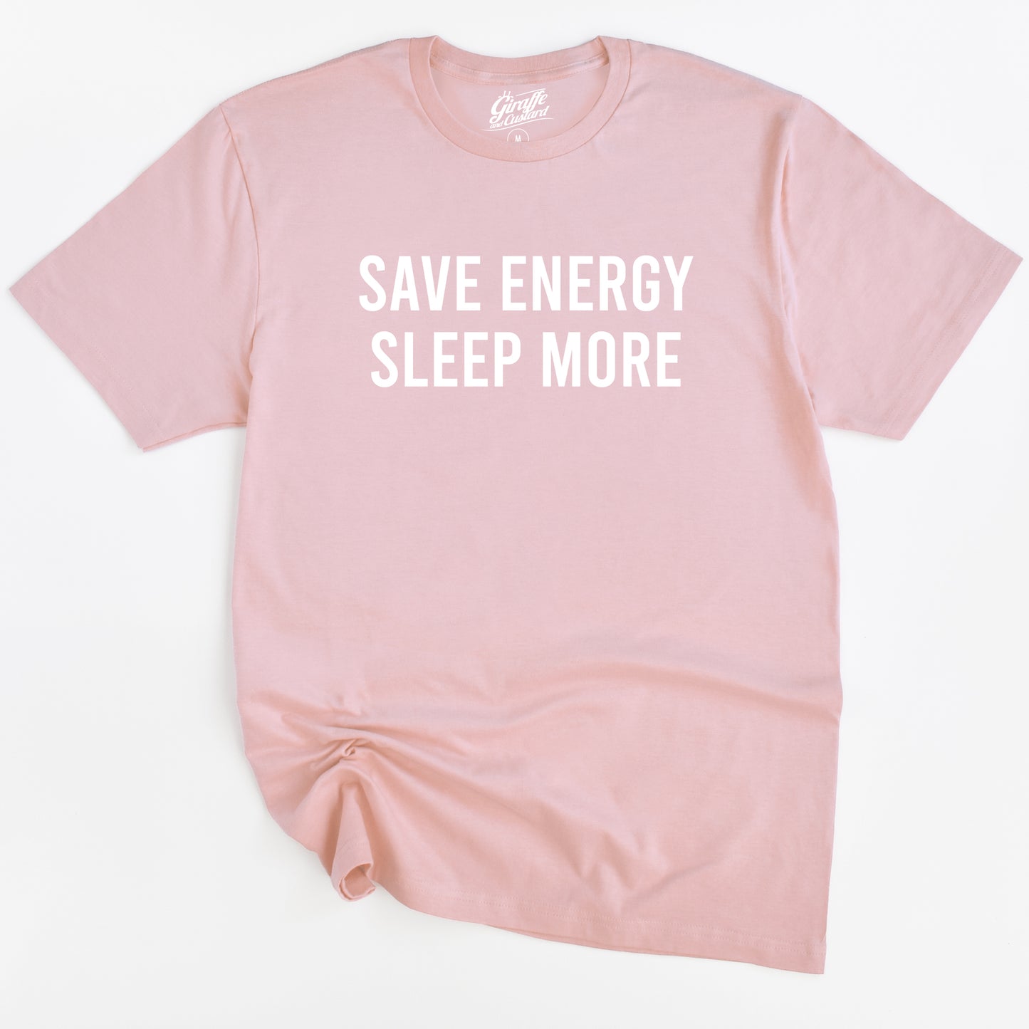 Pink t-shirt with 'SAVE ENERGY SLEEP MORE' text on a white background