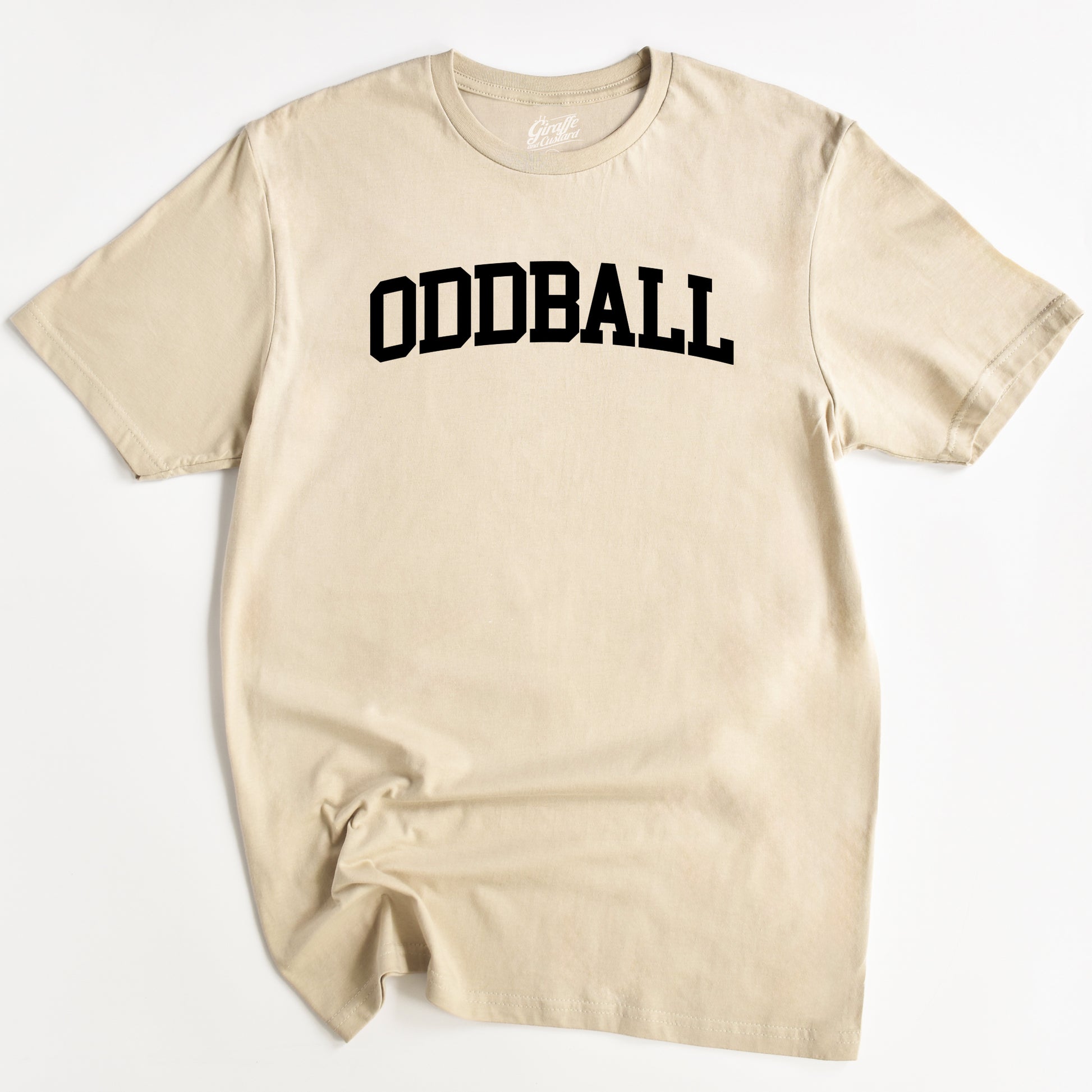 Beige t-shirt with 'ODDBALL' printed in black on a white background