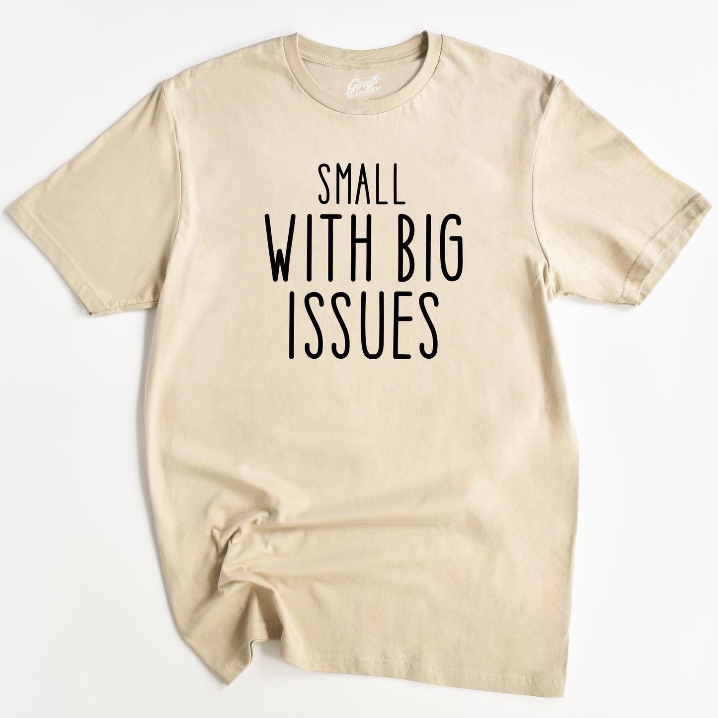 Beige t-shirt with 'Small with Big Issues' text on a white background